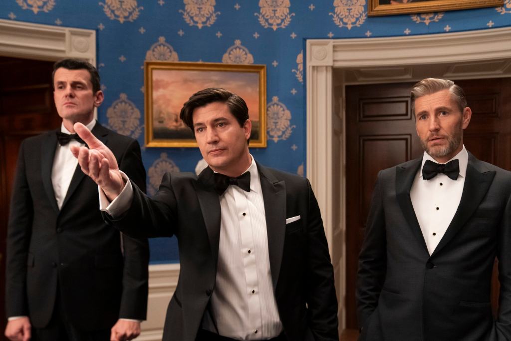 'The Residence' First Look & Teaser 2 The Residence. (L to R) Nathan Lovejoy as Ambassador Alden Tamridge, Ken Marino as Harry Hollinger, Brett Tucker as David Rylance in episode 102 of The Residence. Cr. Jessica Brooks/Netflix © 2024