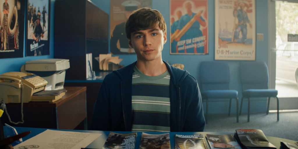 Boots Netflix Recap and Ending Explained: Episode-by-Episode guide 4 BOOTS. Miles Heizer as Cameron Cope in Episode 101 of BOOTS. Cr. Courtesy of Netflix © 2025