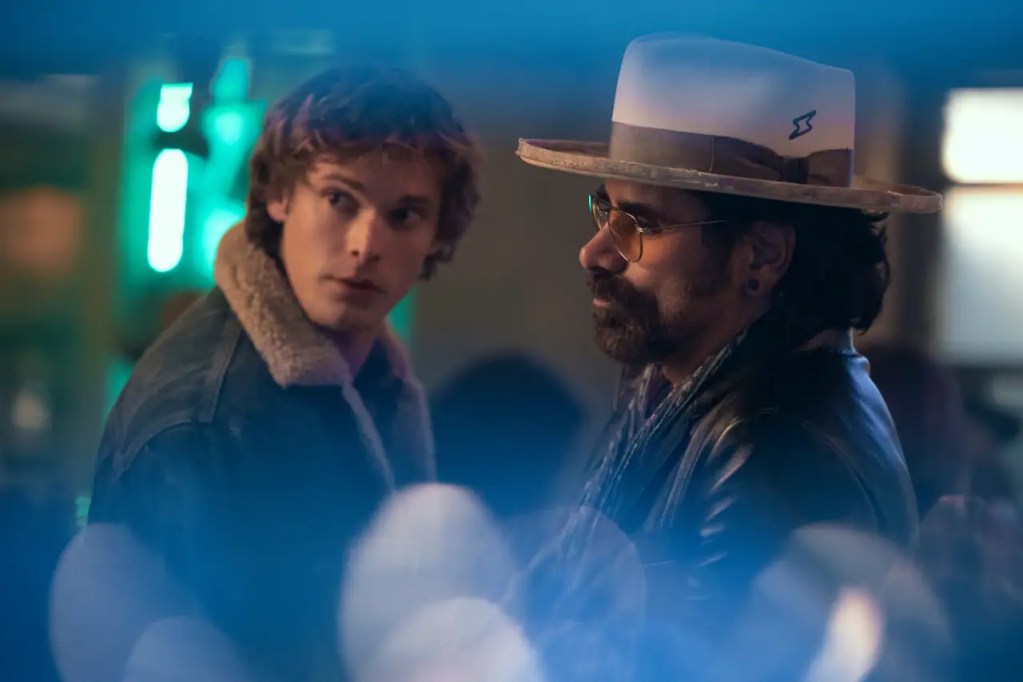The Hunting Wives Season 2 Sets Thanksgiving Release Date as Netflix Reveals First Lookglasses facing forward, colorful lights blurred in the foreground."